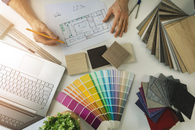 designer working in office doing furniture and flooring material selection from samples for home interior design project. top view designer working in office doing furniture and flooring material selection from samples for home interior design project. top view